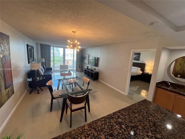 1717 N Bayshore Dr Unit A-1038, Miami, FL 33132 - dining space featuring a chandelier, a textured ceiling, and baseboards
