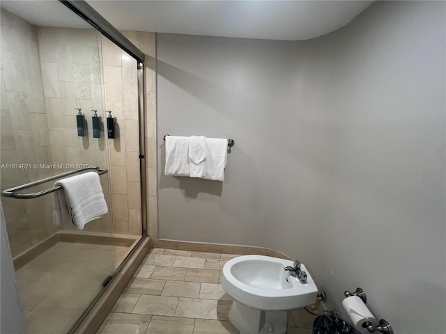 1717 N Bayshore Dr Unit A-1038, Miami, FL 33132 - bathroom featuring a shower stall, a bidet, and baseboards