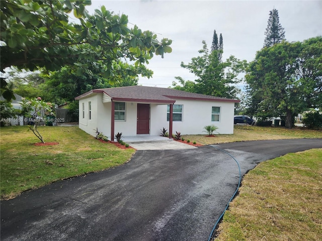2391 NW 132nd St, Miami, FL 33167 - single story home featuring stucco siding, driveway, and a front lawn
