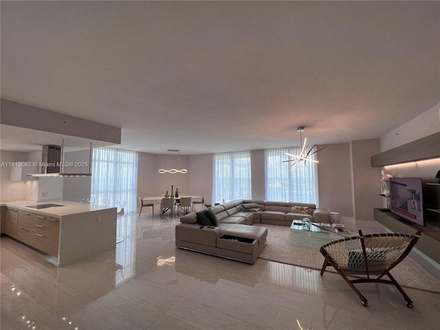 17301 Biscayne Blvd Unit 1402, North Miami Beach, FL 33160 - living room featuring a chandelier, floor to ceiling windows, and light tile patterned flooring