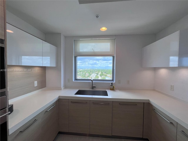 17301 Biscayne Blvd Unit 1402, North Miami Beach, FL 33160 - kitchen featuring a sink, modern cabinets, light countertops, and recessed lighting