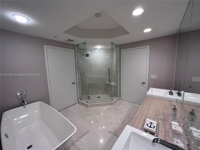 17301 Biscayne Blvd Unit 1402, North Miami Beach, FL 33160 - full bath featuring a shower stall, double vanity, a freestanding bath, marble finish floors, and recessed lighting