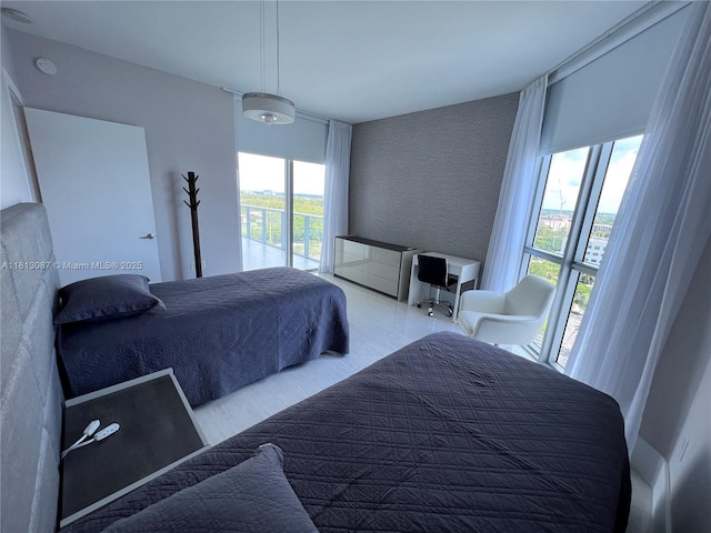 17301 Biscayne Blvd Unit 1402, North Miami Beach, FL 33160 - bedroom featuring an accent wall and multiple windows