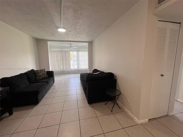 7000 NW 17th St Unit 218, Plantation, FL 33313 - living area featuring light tile patterned floors and a textured ceiling