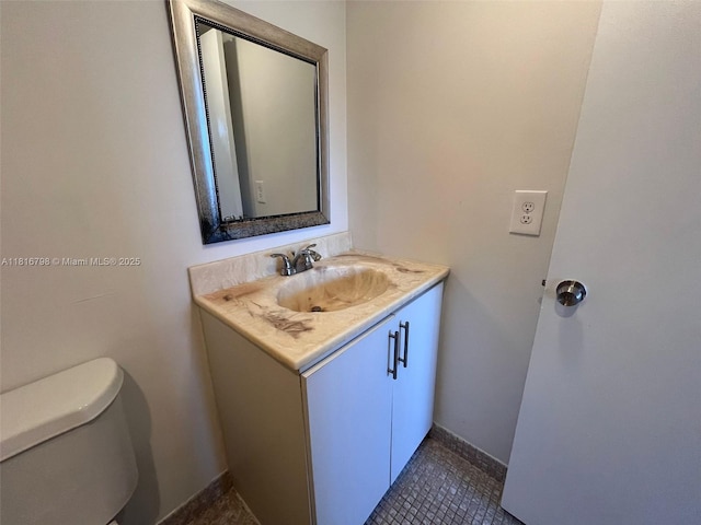 7000 NW 17th St Unit 218, Plantation, FL 33313 - bathroom with vanity, toilet, and tile patterned floors