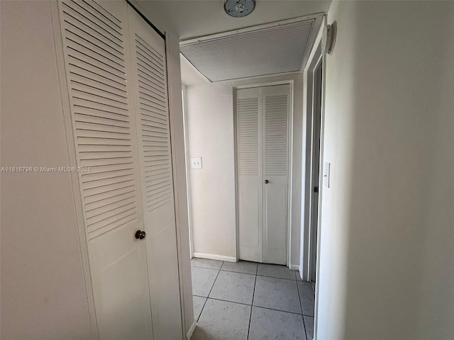 7000 NW 17th St Unit 218, Plantation, FL 33313 - hallway with light tile patterned flooring and baseboards