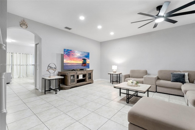 14063 SW 49th Ct Unit 4, Miramar, FL 33027 - living room with arched walkways, light tile patterned floors, ceiling fan, recessed lighting, and baseboards