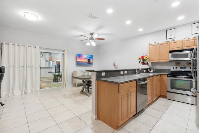 14063 SW 49th Ct Unit 4, Miramar, FL 33027 - kitchen with appliances with stainless steel finishes, a peninsula, a sink, recessed lighting, and dark countertops