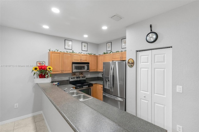 14063 SW 49th Ct Unit 4, Miramar, FL 33027 - kitchen featuring stainless steel appliances, a sink, recessed lighting, light tile patterned floors, and baseboards