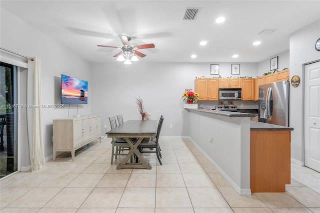 14063 SW 49th Ct Unit 4, Miramar, FL 33027 - kitchen with appliances with stainless steel finishes, recessed lighting, ceiling fan, a peninsula, and light tile patterned floors