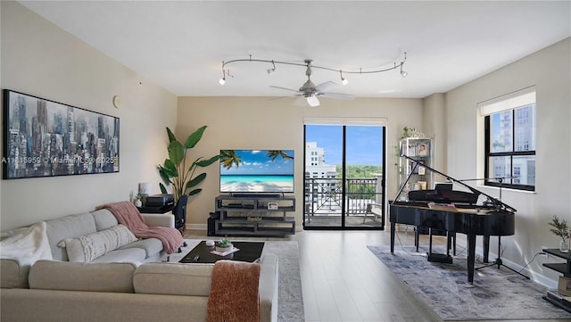 8390 SW 72nd Ave Unit 811, Miami, FL 33143 - living room with wood finished floors, ceiling fan, and baseboards