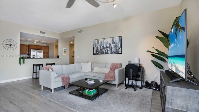 8390 SW 72nd Ave Unit 811, Miami, FL 33143 - living area with wood finished floors, rail lighting, baseboards, and ceiling fan