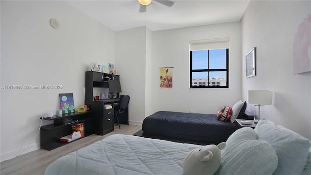 8390 SW 72nd Ave Unit 811, Miami, FL 33143 - bedroom featuring light wood-style flooring, ceiling fan, and baseboards