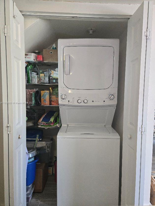 4560 SW 68th Ct Cir Unit 61-9, Miami, FL 33155 - laundry room with stacked washer and clothes dryer