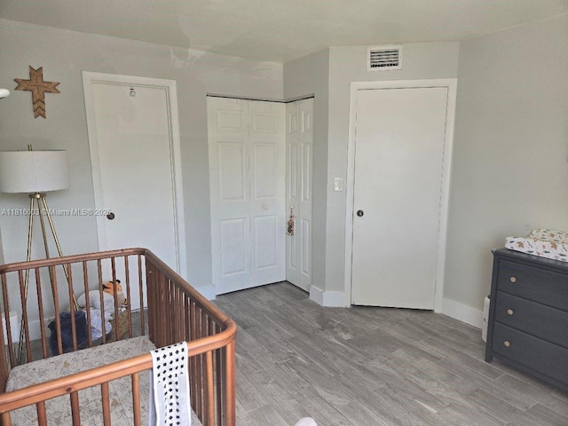 4560 SW 68th Ct Cir Unit 61-9, Miami, FL 33155 - bedroom with wood finished floors and a crib