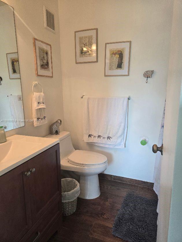4560 SW 68th Ct Cir Unit 61-9, Miami, FL 33155 - bathroom featuring toilet, wood finished floors, and vanity