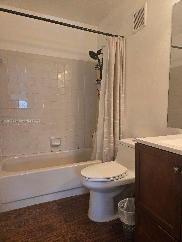 4560 SW 68th Ct Cir Unit 61-9, Miami, FL 33155 - bathroom with toilet, wood finished floors, shower / bath combo, and vanity