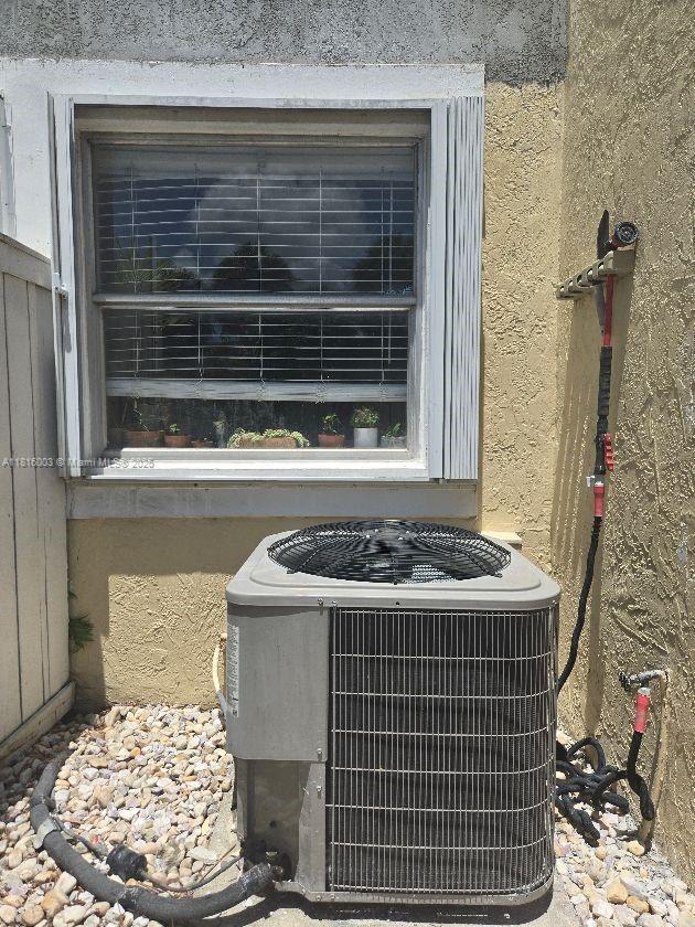 4560 SW 68th Ct Cir Unit 61-9, Miami, FL 33155 - exterior view of cooling unit and stucco siding