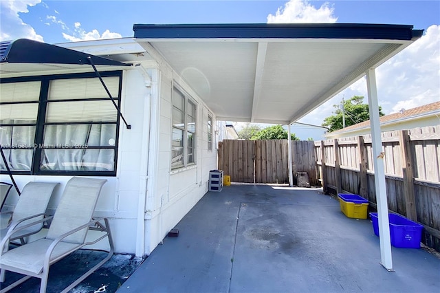 1109 S M St, Lake Worth, FL 33460 - view of property exterior with a carport and a patio
