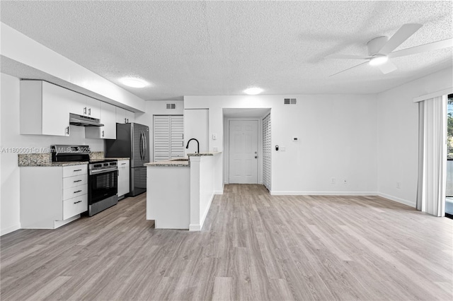 2094 Arbour Walk Unit 318, Naples, FL 34109 - kitchen with stainless steel appliances, under cabinet range hood, a ceiling fan, light wood-style floors, and a textured ceiling