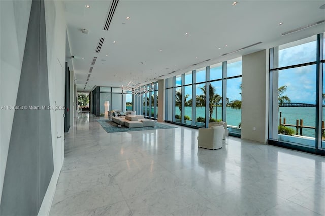 3131 NE 7th Ave Unit 1702, Miami, FL 33137 - lobby featuring a wall of windows and a water view