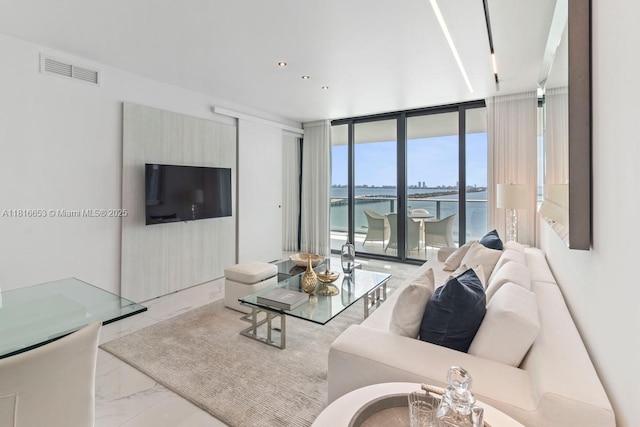 3131 NE 7th Ave Unit 1702, Miami, FL 33137 - living room featuring expansive windows and marble finish flooring