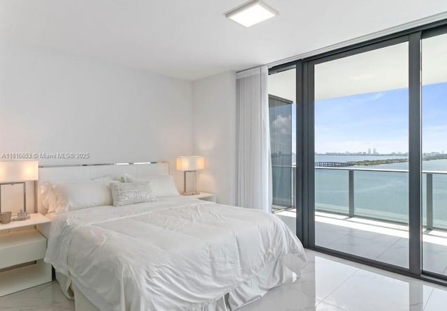 3131 NE 7th Ave Unit 1702, Miami, FL 33137 - bedroom featuring expansive windows, a water view, access to outside, and marble finish flooring
