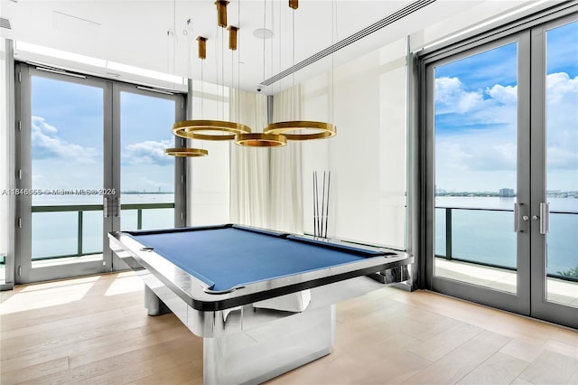 3131 NE 7th Ave Unit 1702, Miami, FL 33137 - playroom with french doors, a water view, and light wood finished floors