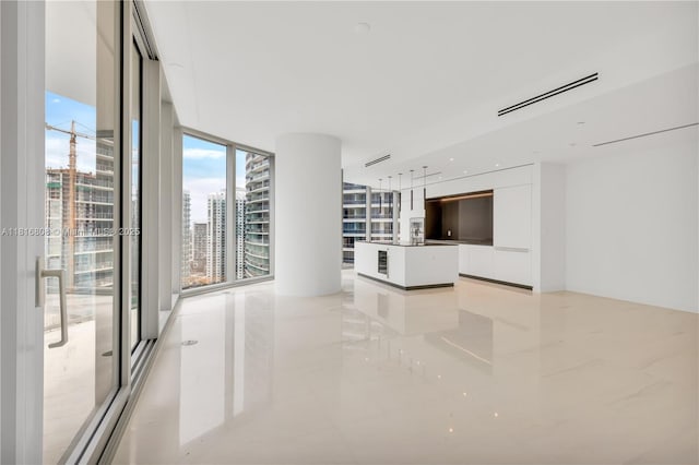 300 Biscayne Blvd Way Unit 2907, Miami, FL 33131 - unfurnished living room with a wall of windows, a view of city, and light tile patterned floors