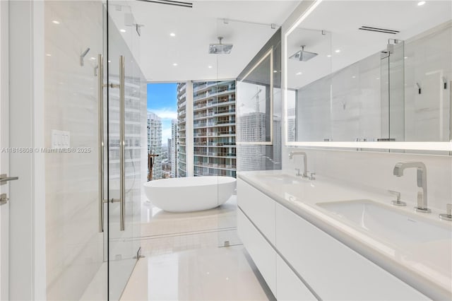 300 Biscayne Blvd Way Unit 2907, Miami, FL 33131 - full bath with a shower stall, a soaking tub, double vanity, a view of city, and a wall of windows