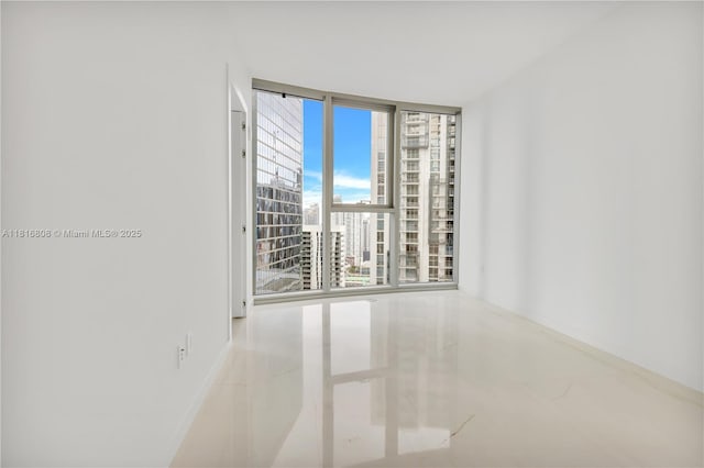 300 Biscayne Blvd Way Unit 2907, Miami, FL 33131 - empty room with expansive windows and tile patterned floors