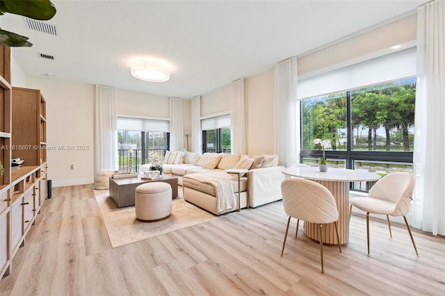 8001 NW 41st St Unit F-107, Doral, FL 33166 - living room with light wood finished floors