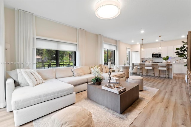 8001 NW 41st St Unit F-107, Doral, FL 33166 - living area featuring plenty of natural light, light wood-type flooring, and recessed lighting