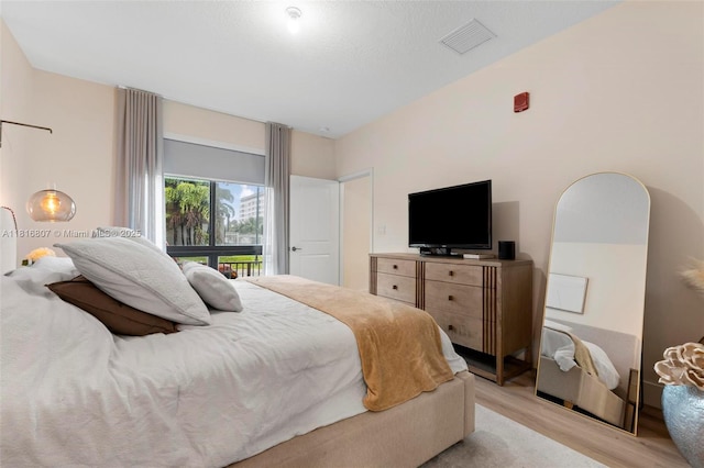 8001 NW 41st St Unit F-107, Doral, FL 33166 - bedroom featuring light wood finished floors