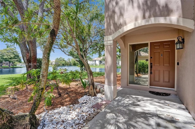 2388 NW 97th Way, Pembroke Pines, FL 33024 - doorway to property featuring a water view and stucco siding