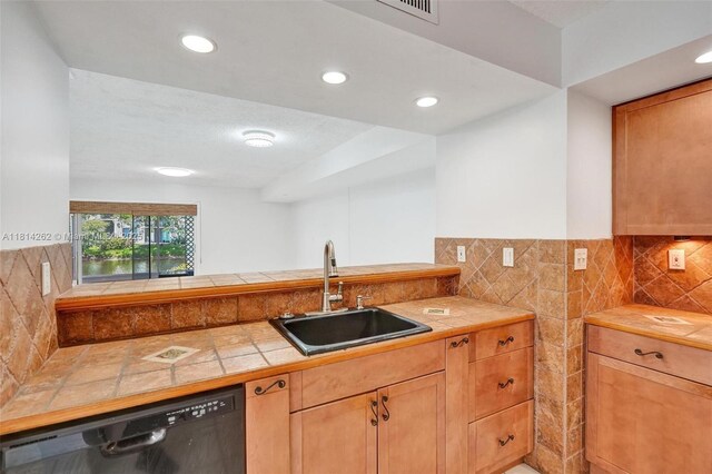 2388 NW 97th Way, Pembroke Pines, FL 33024 - kitchen featuring black dishwasher, tile counters, recessed lighting, and backsplash