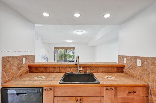 2388 NW 97th Way, Pembroke Pines, FL 33024 - kitchen featuring black dishwasher, tile countertops, backsplash, and recessed lighting