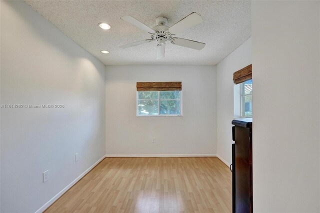 2388 NW 97th Way, Pembroke Pines, FL 33024 - empty room featuring plenty of natural light, light wood-type flooring, a textured ceiling, a ceiling fan, and recessed lighting