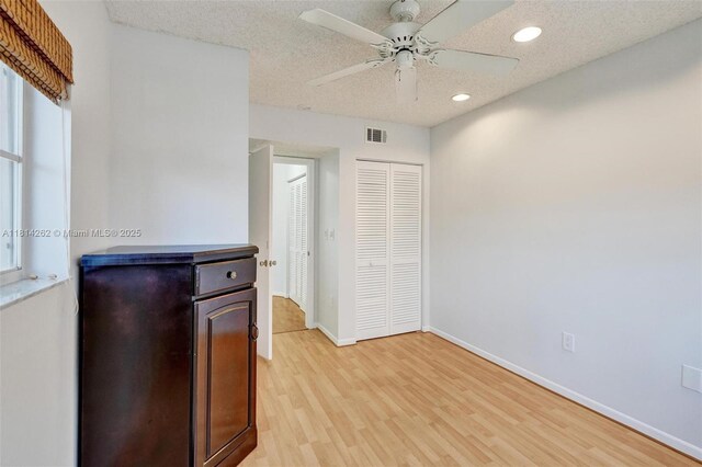 2388 NW 97th Way, Pembroke Pines, FL 33024 - kitchen with light wood-style floors, recessed lighting, a ceiling fan, and a textured ceiling