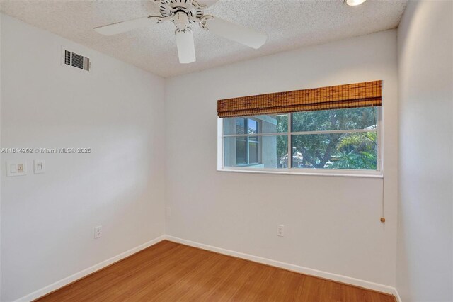 2388 NW 97th Way, Pembroke Pines, FL 33024 - spare room with wood finished floors, a textured ceiling, and ceiling fan