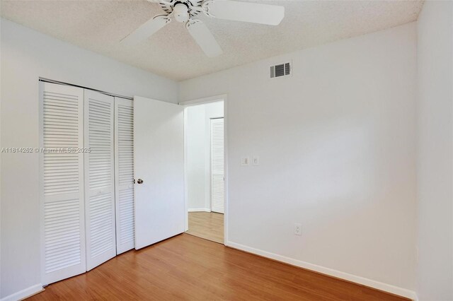 2388 NW 97th Way, Pembroke Pines, FL 33024 - unfurnished bedroom featuring wood finished floors, a closet, and ceiling fan