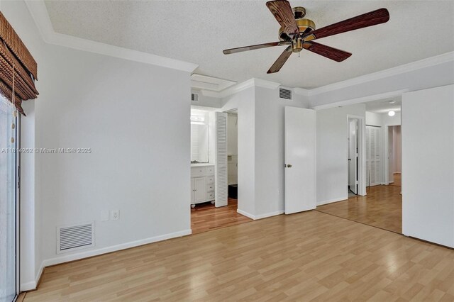 2388 NW 97th Way, Pembroke Pines, FL 33024 - unfurnished bedroom with light wood-type flooring, ornamental molding, ensuite bath, and ceiling fan