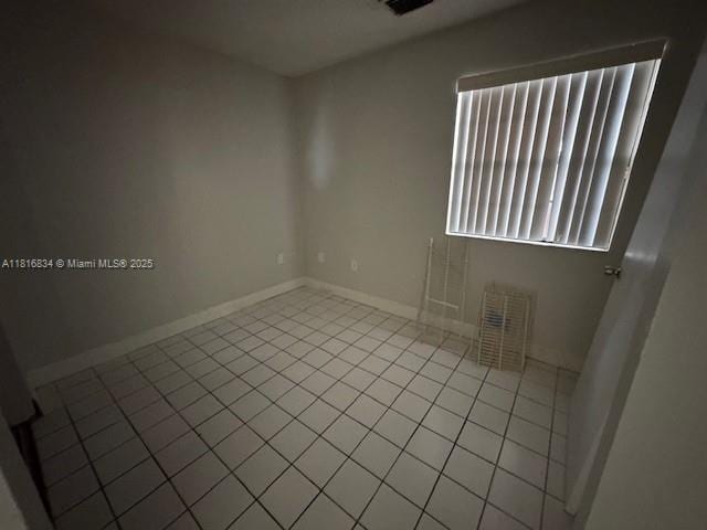 10626 SW 148th Ave Dr, Miami, FL 33196 - tiled spare room featuring baseboards