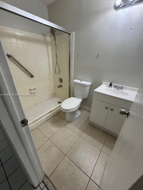 10626 SW 148th Ave Dr, Miami, FL 33196 - full bathroom with toilet, vanity, a shower stall, and tile patterned floors