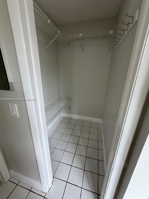 10626 SW 148th Ave Dr, Miami, FL 33196 - walk in closet featuring light tile patterned floors