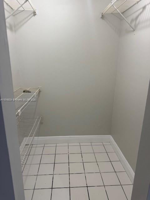 10626 SW 148th Ave Dr, Miami, FL 33196 - walk in closet with light tile patterned floors