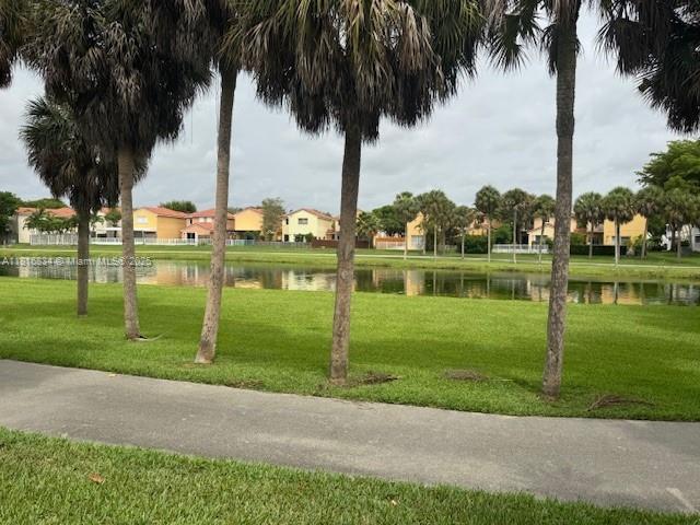 10626 SW 148th Ave Dr, Miami, FL 33196 - view of community with a lawn and a water view
