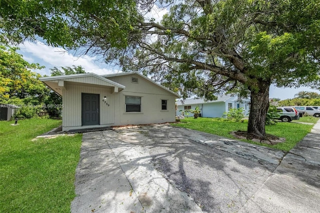 6359 SW 1st St, Margate, FL 33068 - bungalow featuring a front yard and concrete driveway