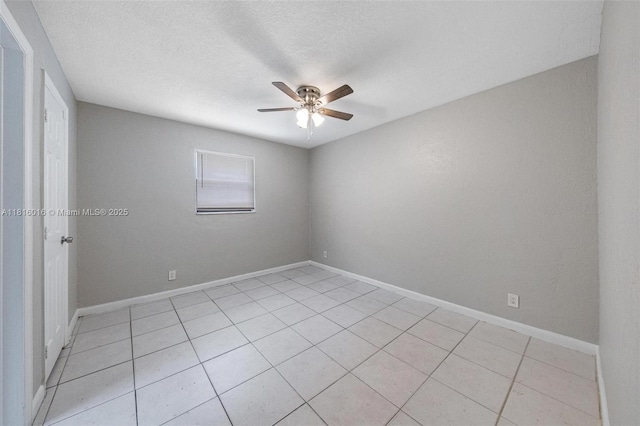 6359 SW 1st St, Margate, FL 33068 - spare room with a ceiling fan, light tile patterned floors, a textured ceiling, and baseboards