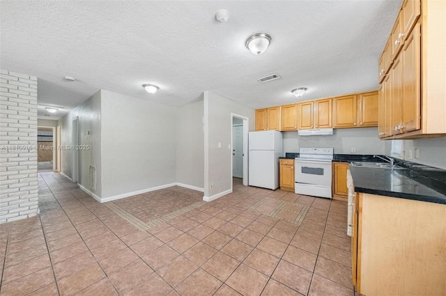 6359 SW 1st St, Margate, FL 33068 - kitchen featuring white appliances, dark countertops, baseboards, a sink, and under cabinet range hood